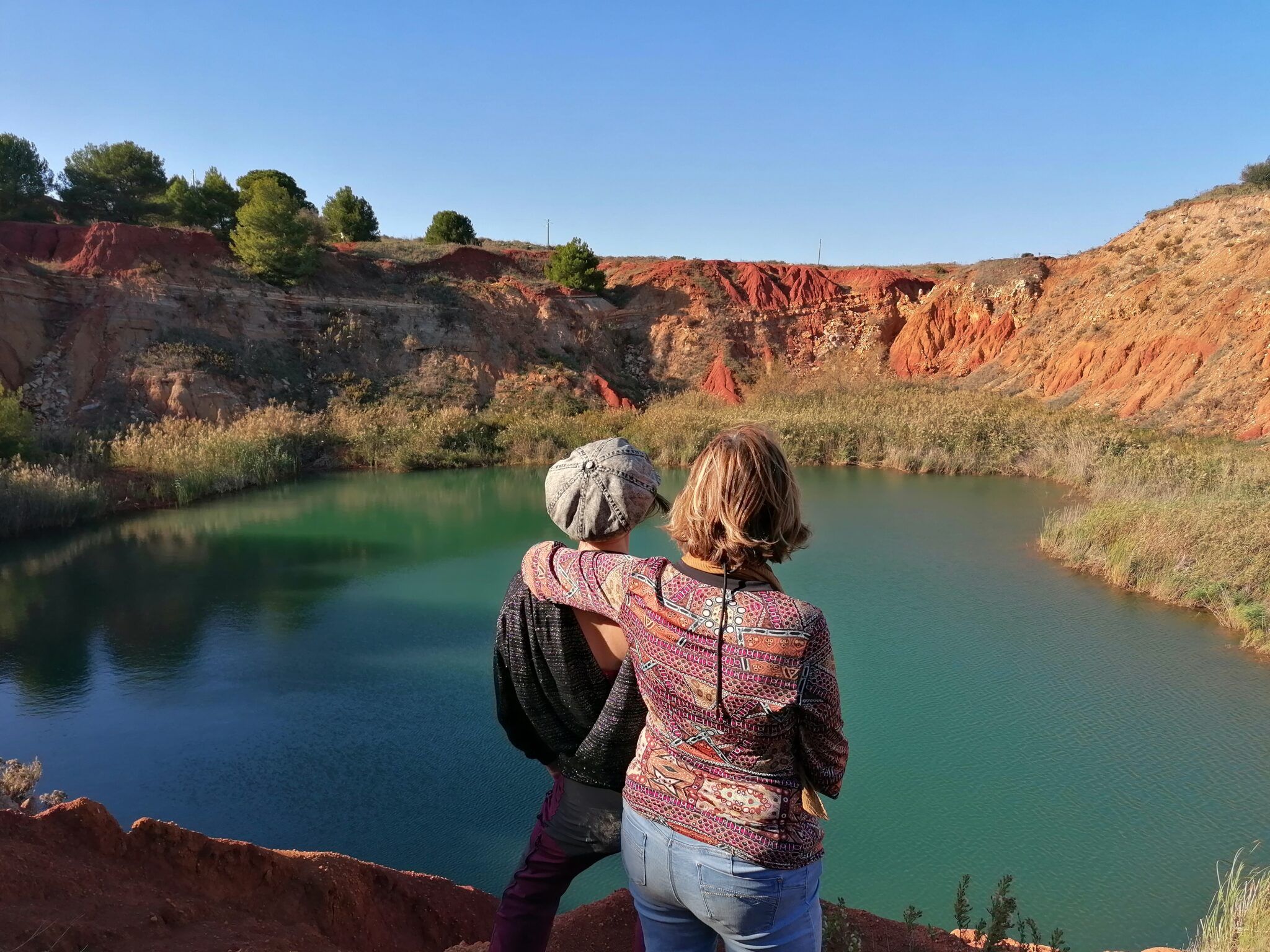 Lydia and Catherine facing the Bauxite Lake