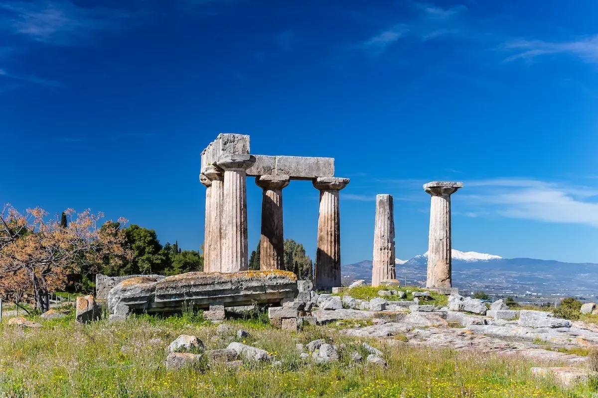 An ancient Greek ruin surrounded by nature