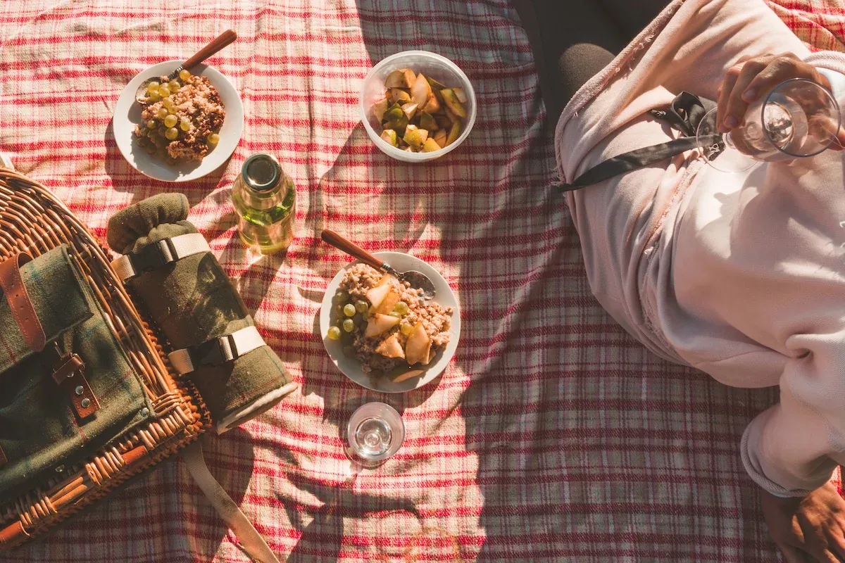 A picnic tablecloth with some food